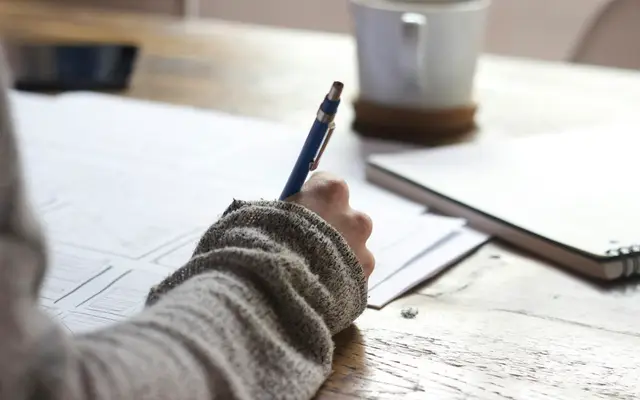 Student writing an exam application